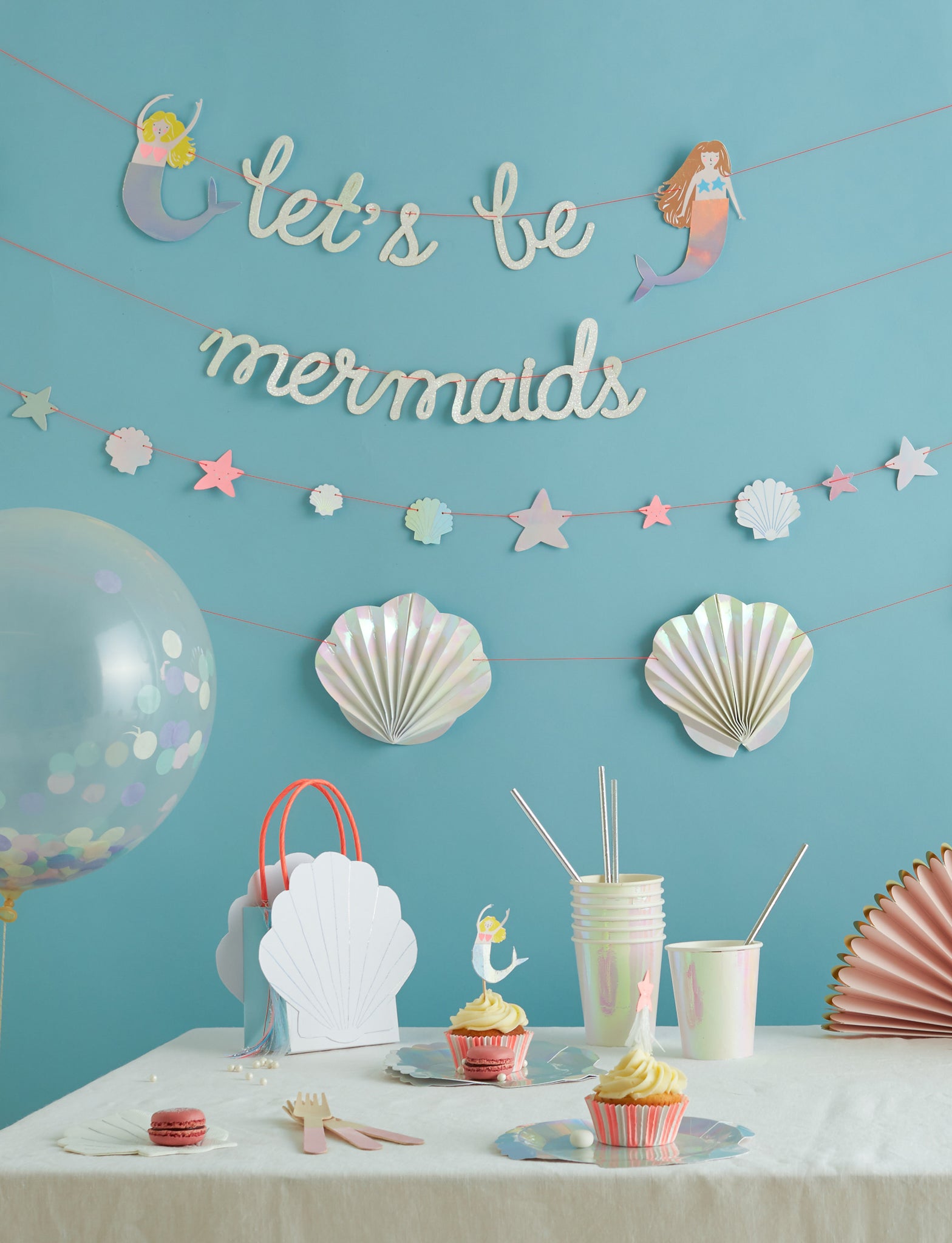 They're perfect for any "under the sea" theme, from Clown Fish to Mermaids, to beach themed bridal or baby showers. The shell shaped plates, favor boxes, and napkins are polished with holographic foil and sure to shimmer.