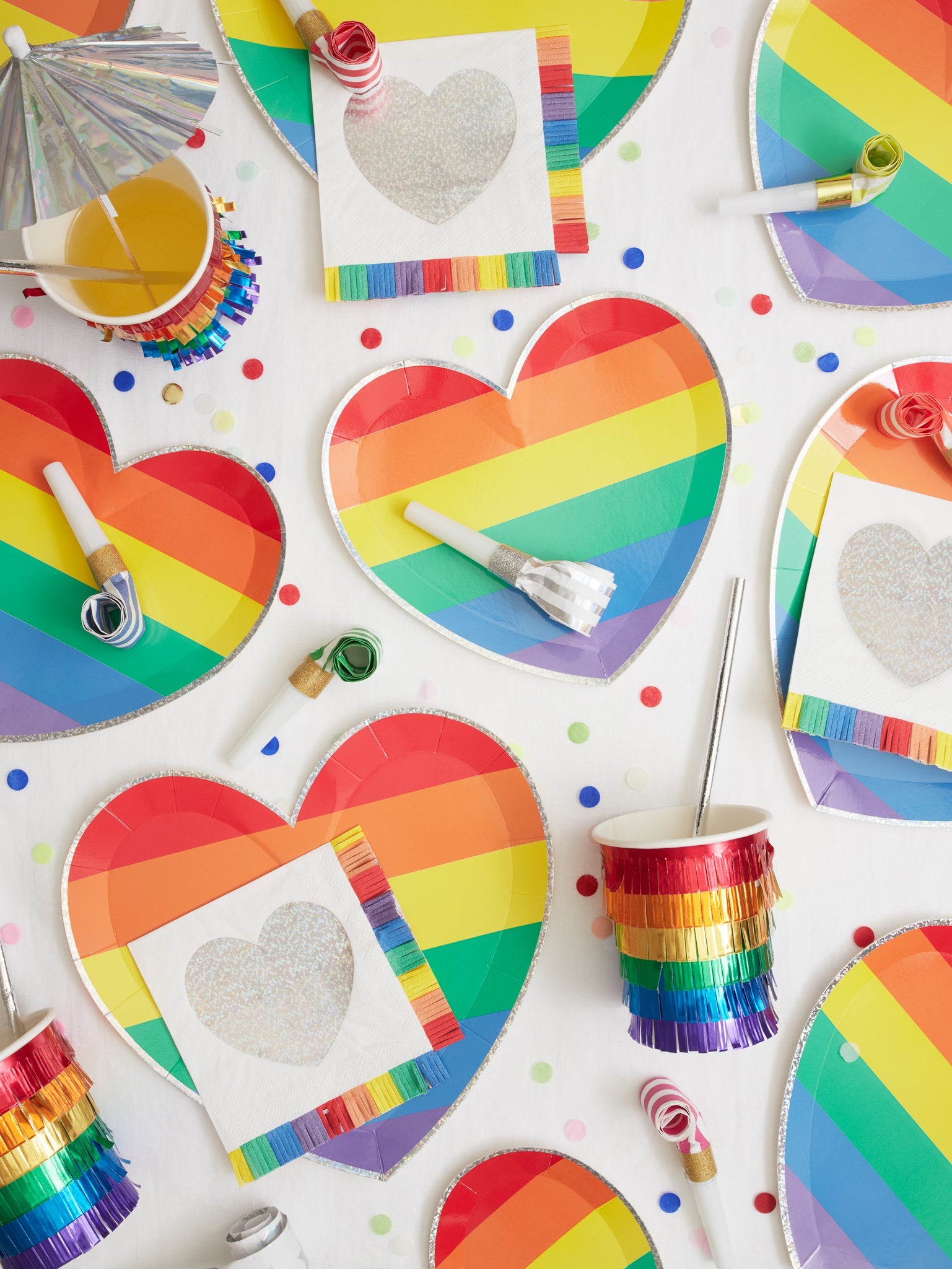 Add some whimsy to your tablescape with these beautiful rainbow party supplies! And it's not all about the table, we have rainbow balloon kits, candles, and treat cups to complete your party setup.