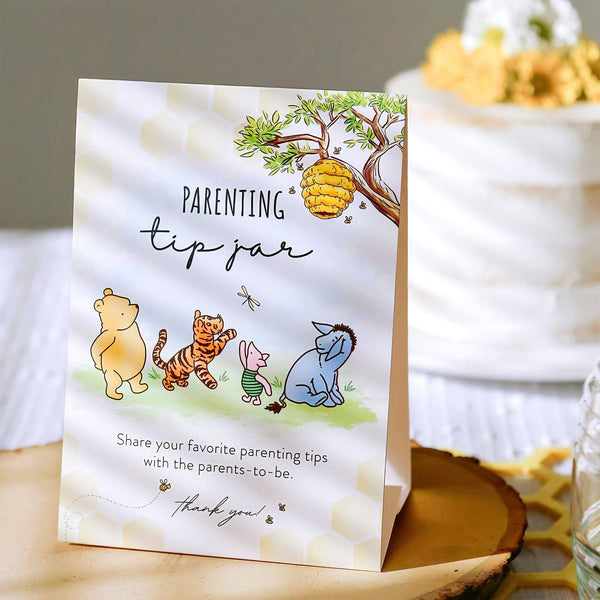 Card with cartoon characters and 'Parenting tip jar' text on a wooden surface.