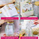 Glass jars with gold lids and advice cards for parents-to-be on a table.
