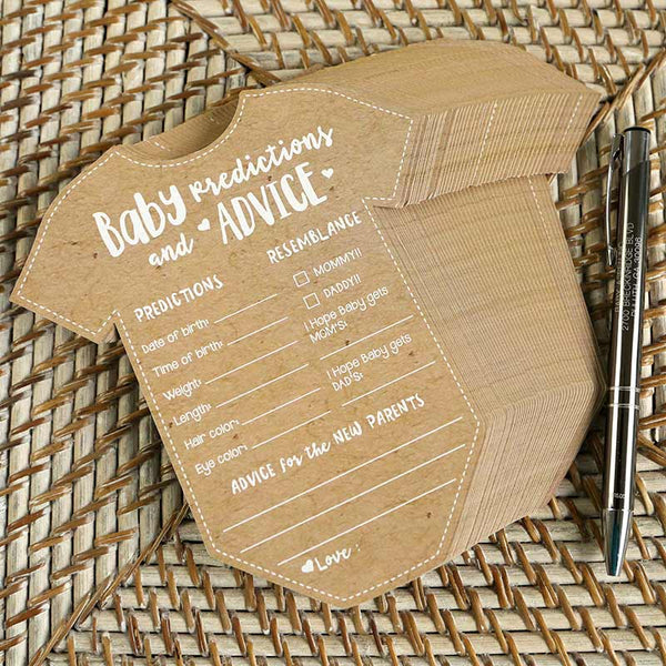 Kraft paper baby shower prediction and advice card on a woven surface with a pen.