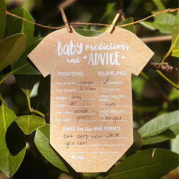 Baby predictions and advice card shaped like a onesie hanging on green leaves