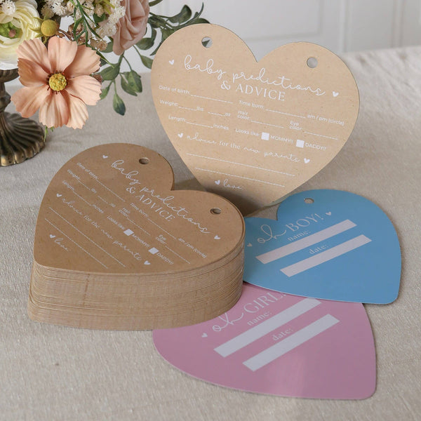 Heart-shaped baby prediction and advice cards with a blue and pink card on a neutral background.
