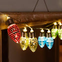 String of colorful disco light bulbs hanging against a dark background.
