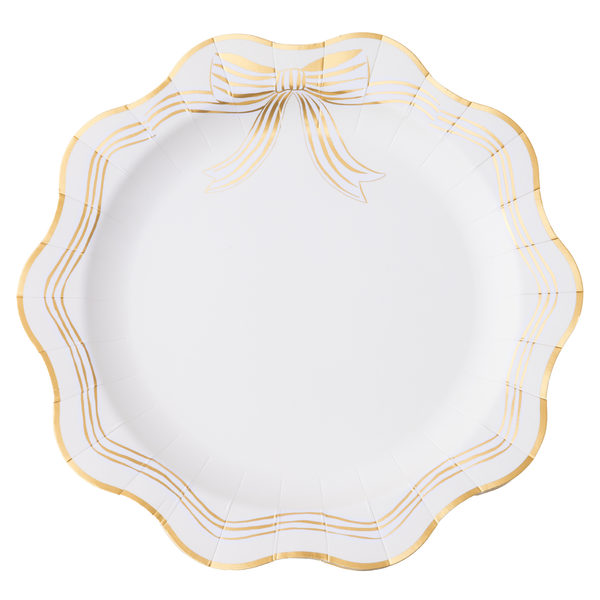 White paper plate with gold decorative edge on a white background