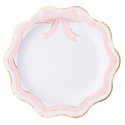 Decorative plate with pink bow and scalloped edge on a white background