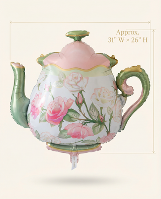 Decorative teapot with floral design on a beige background