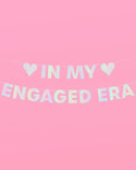 Decorative banner with 'IN MY ENGAGED ERA' text on a pink background
