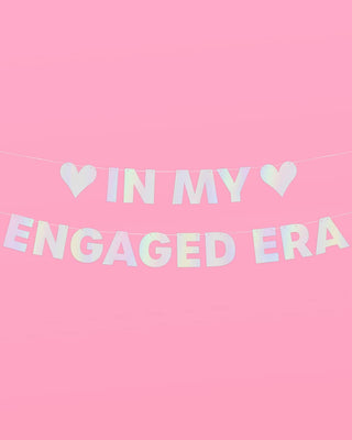 Decorative banner with 'IN MY ENGAGED ERA' text on a pink background