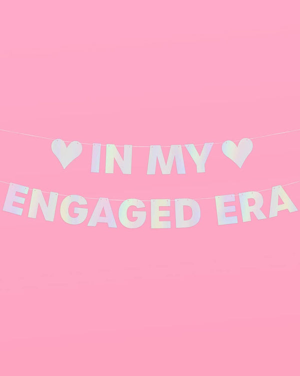 Decorative banner with 'IN MY ENGAGED ERA' text on a pink background