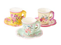 Three decorative paper cups with floral patterns on saucers against a white background