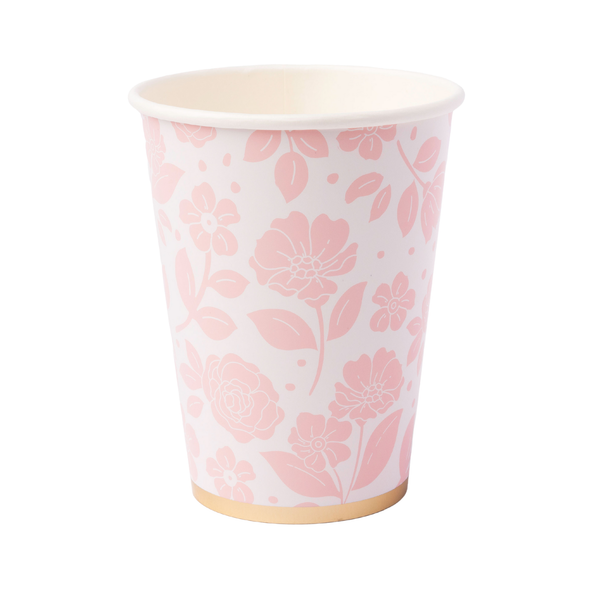 Paper cup with pink floral pattern on a white background