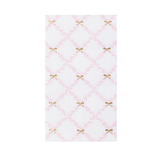 White towel with pink diamond pattern and gold bows on a white background