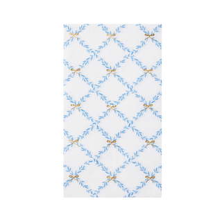 Patterned paper with blue and gold designs on a white background