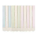 Pastel striped curtain with scalloped edge on a white background