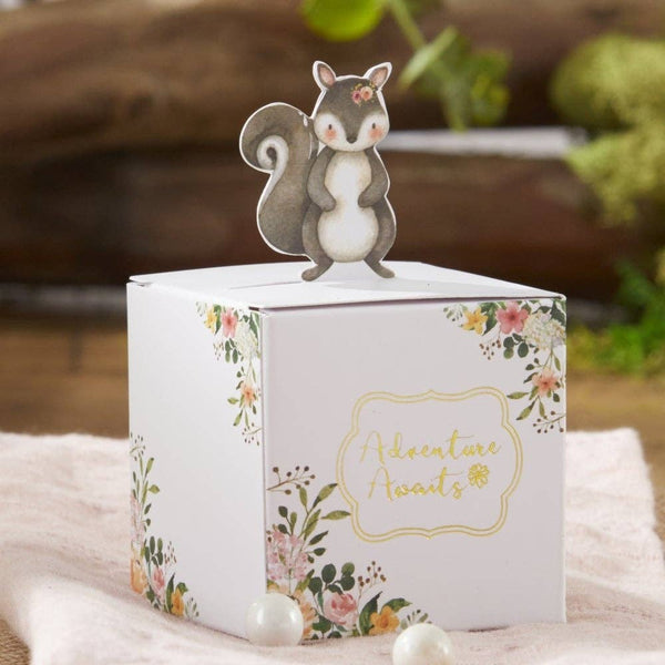 Card with a squirrel topper and floral design on a soft surface