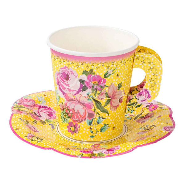Yellow floral teacup and saucer set on a white background