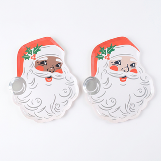 Black Santa and White Santa vintage St. Nick paper plates lying flat side by side