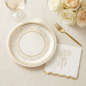 Coordinating gold foil floral napkin and gold-and-cream plate styled together