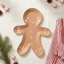 Gingerbread man shaped plate styled with Christmas accents