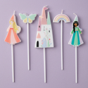 Princess candle flat lay on a soft dusty-lavender background