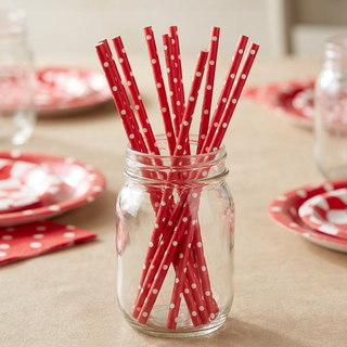 Red polka dot paper straws in a clear mason jar