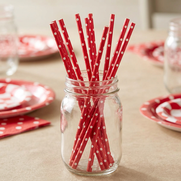 Red polka dot paper straws in a clear mason jar