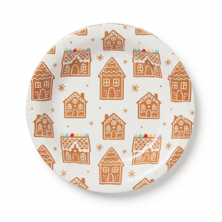 Round gingerbread house plate on a white background