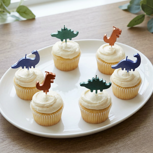 Six cupcakes arranged with matching dinosaur candles opposite each other