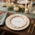 Thankful wreath plate layered over the Grateful Thankful plate as a charger on a candlelit table