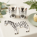 Zebra napkin and matching zebra cups styled on a safari party table